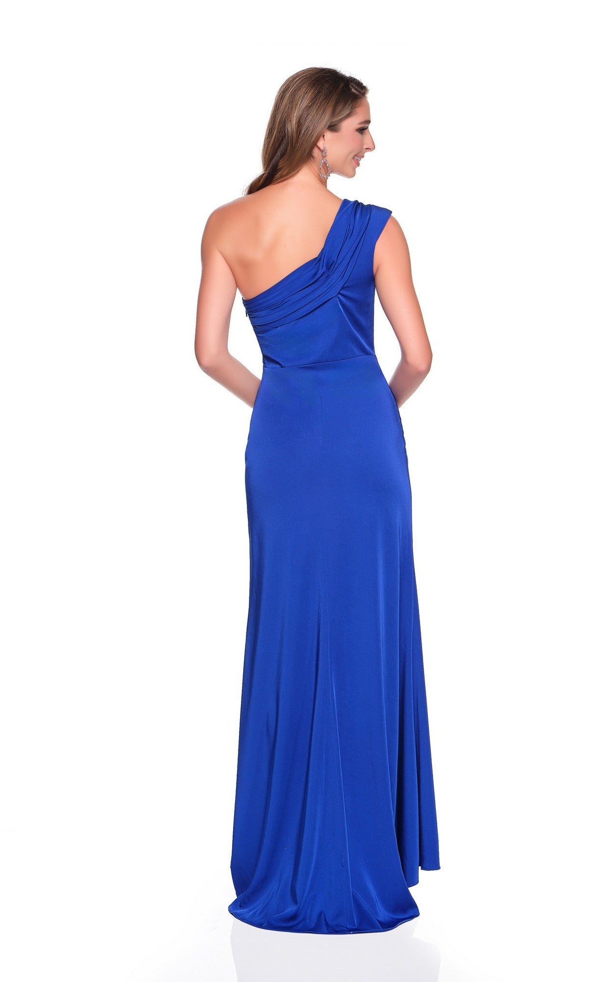 A woman stands with her back to the camera in a floor-length, one-shoulder royal-blue